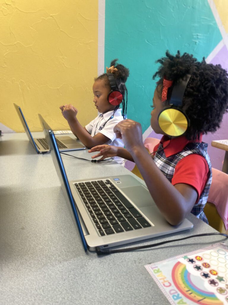 preschoolers working on the computer